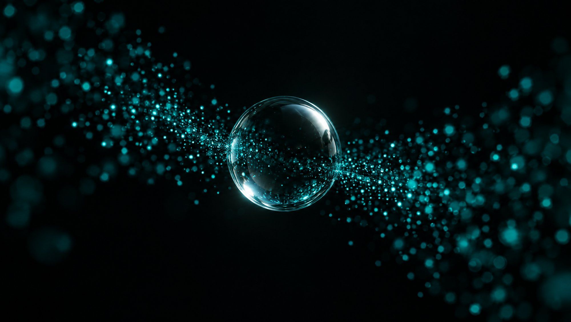 A clear glass sphere suspended in a loose stream of tiny glowing teal particles against black.
